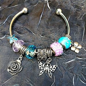 Silver bangle with beads & charms